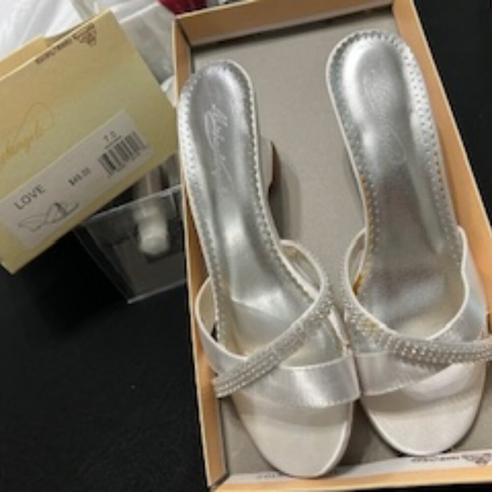 Michelangelo brides shoes size 7 and bridesmaids black heels size 8.